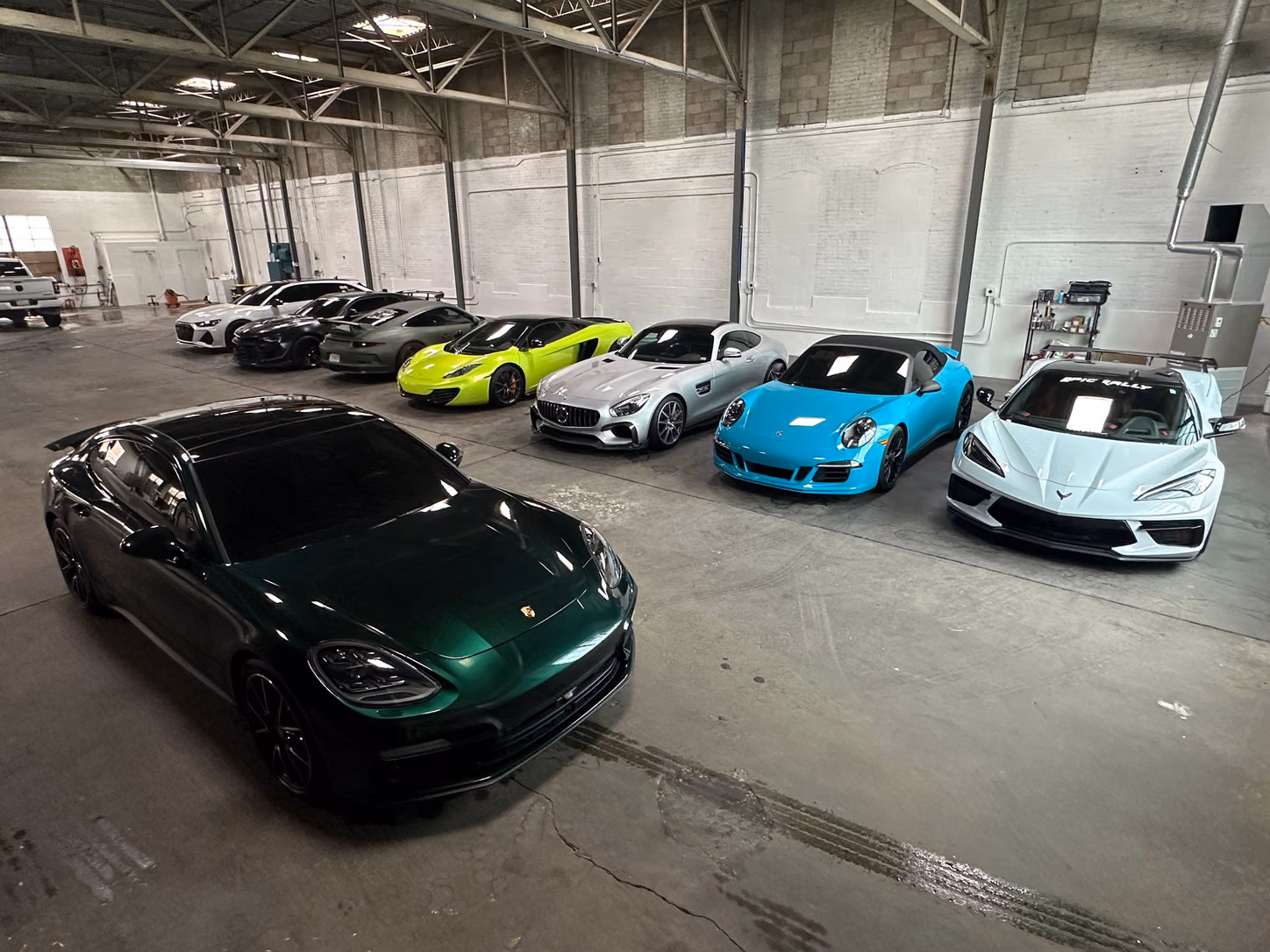 A row of sports cars in the shop