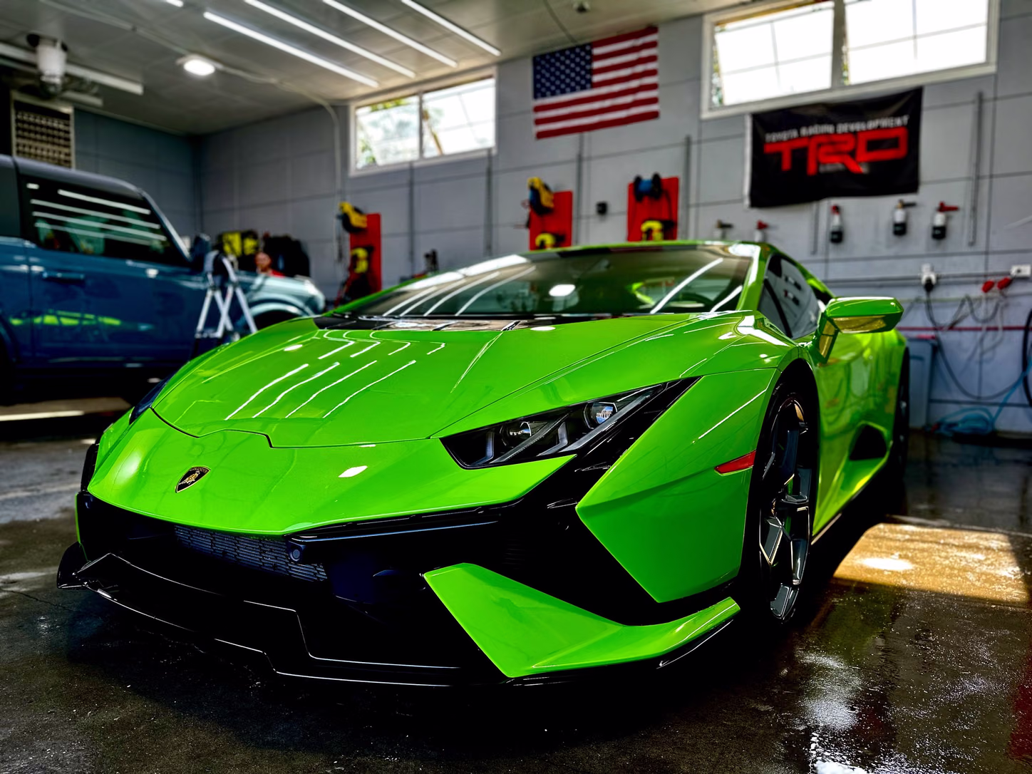 Green Lamborghini Huracán in the bay